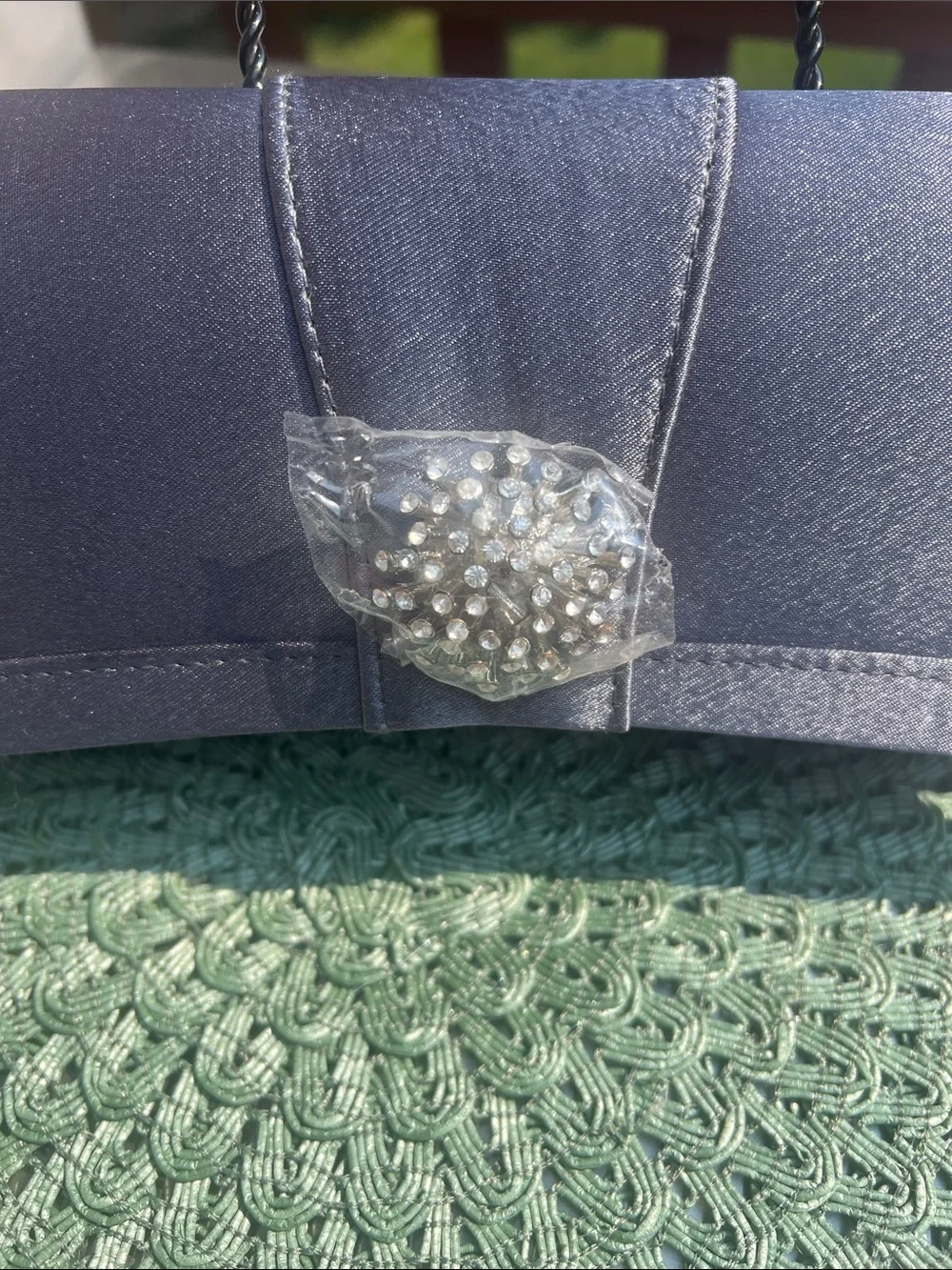 NWOT Gray Evening Clutch with clear crystal embellishment.